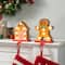 Glitzhome® Marquee LED Gingerbread House & Gingerbread Man Christmas Stocking Holder Set